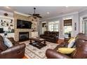 Cozy living room featuring a stone fireplace and comfortable leather seating at 512 Allspice Ln., Myrtle Beach, SC 29579