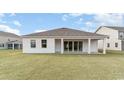 A spacious backyard with a well-maintained lawn, perfect for outdoor activities and relaxation at 512 Haven View Way, Murrells Inlet, SC 29576