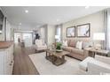 Cozy living room featuring a comfortable sofa, stylish decor, and ample natural light at 532 Ryegrass Way # 0029B, Murrells Inlet, SC 29576