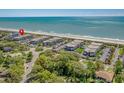 Coastal condominium complex near the beach with mature trees and lush landscaping at 5601 N Ocean Blvd. # E-304, Myrtle Beach, SC 29577