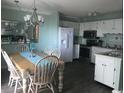 A well-lit kitchen area with modern appliances and a dining table is conveniently located near the kitchen at 5905 S Kings Hwy. # 314-B, Myrtle Beach, SC 29575