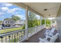 Relaxing porch featuring comfortable seating and scenic views of lush greenery and waterfront homes at 6001-1872 S Kings Hwy., Myrtle Beach, SC 29575