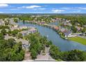 Aerial view of a waterfront community featuring beautiful homes and scenic waterways surrounded by lush trees at 601 Hillside Dr. N # 1405, North Myrtle Beach, SC 29582