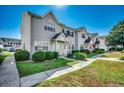 Townhouse complex featuring lush landscaping, well-kept lawns and sidewalks at 615 2Nd Ave. S # 25B, North Myrtle Beach, SC 29582