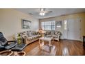 Bright living room with laminate flooring and large window bringing in light at 615 2Nd Ave. S # 25B, North Myrtle Beach, SC 29582