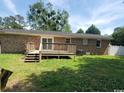 Spacious backyard with a wooden deck, offering a private outdoor space for relaxation and entertainment at 615 Burcale Road Circle, Myrtle Beach, SC 29579