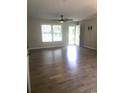 Bright and airy living room featuring sleek wood floors and a modern ceiling fan at 615 Burcale Road Circle, Myrtle Beach, SC 29579