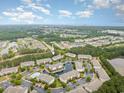 Spacious condo community featuring a pool, pond, multiple buildings, mature landscaping, and parking at 6253 Catalina Dr. # 131, North Myrtle Beach, SC 29582