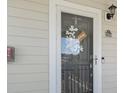 Inviting front door with a welcome wreath and stylish hardware, number 534, shows charm and curb appeal at 6253 Catalina Dr. # 534, North Myrtle Beach, SC 29582