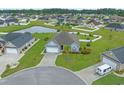Aerial view of a well-manicured single-Gathering home and community with a pond at 713 Garland Ct., Myrtle Beach, SC 29588