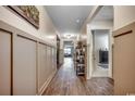 Inviting hallway with beautiful wood floors and stylish wall trim, leading to living spaces at 777 Woodland Farms Circle, Aynor, SC 29511