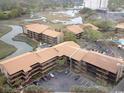 Aerial shot of the condo complex, showcasing lush greenery and marsh views at 9501 Shore Dr. # D-237, Myrtle Beach, SC 29572