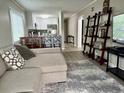 Inviting living room with modern decor, open to a sleek, white kitchen at 9501 Shore Dr. # D-237, Myrtle Beach, SC 29572