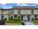 Townhouse complex featuring well-maintained landscaping and assigned unit numbers at 1012 Possum Trot Rd. # F 42, North Myrtle Beach, SC 29582