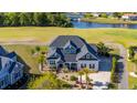 Stunning aerial view of a beautiful home located on a golf course near a serene lake at 1017 Gallinule Dr., Conway, SC 29526