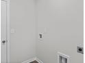 Neutral laundry room with hookups and base molding at 1031 Sentinel Ct., Little River, SC 29566