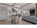 Bright and airy living room showcasing an open floor plan and wood flooring at 115 Forman Way, Aynor, SC 29511