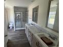Bathroom with double sinks, tile floors, and glass shower at 116 Forman Way, Aynor, SC 29511