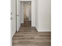 Hallway featuring durable wood-look flooring and neutral-toned walls at 116 Forman Way, Aynor, SC 29511