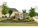 The Carson's Ferry neighborhood entrance sign, surrounded by manicured landscaping and flowering plants at 1308 Riverport Dr., Conway, SC 29526