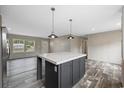 Modern kitchen featuring an island, stainless steel appliances, and ample cabinet space at 1310 Rabbit Ln., Conway, SC 29526
