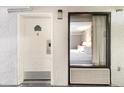 The exterior of a hotel room door with a window showing the bedroom interior with a comfortable queen bed at 1501 S Ocean Blvd. # 1044, Myrtle Beach, SC 29577