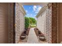 View through the covered entryway showing a garden path leading to the front of the house at 1504 Sedgefield Dr., Murrells Inlet, SC 29576