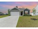 Charming single story home with a two car garage and manicured lawn at 1804 Castlebay Dr., Conway, SC 29526