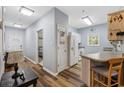 Open-concept living space featuring hardwood floors, kitchen, and stylish decor at 2090 Cross Gate Blvd. # 202, Surfside Beach, SC 29575
