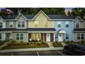 Charming townhomes feature colorful exteriors, landscaped front yards, and convenient parking in front at 2728 Mercer Dr. # 2728, Conway, SC 29526