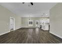 Bright living room with an open layout that flows seamlessly into a modern kitchen with stainless appliances at 2919 Hughes Gasque Rd., Aynor, SC 29511