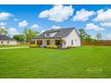 Well-maintained home with a lush lawn and mature trees creating a peaceful setting at 3117 Chapel Rd., Loris, SC 29569
