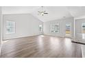 Bright living room with vaulted ceilings, light wood floors and an abundance of natural light at 3324 Little Bay Dr., Conway, SC 29526