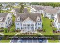 Eye-level aerial view of a two-story condo with well-manicured lawns and landscaping at 339 Black Oak Ln. # 201, Murrells Inlet, SC 29576
