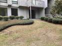 Well-maintained condo with green landscaping around the building at 409 Salt Marsh Circle # 20C, Pawleys Island, SC 29585