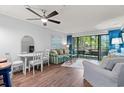 Cozy living area with a comfortable sofa, bright white walls, and a sliding glass door to the outdoors at 415 Ocean Creek Dr. # 2145, Myrtle Beach, SC 29572