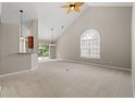 Bright open-concept living room with vaulted ceilings, carpet, and natural light at 4165 Eva Bay Dr., Murrells Inlet, SC 29576