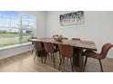 Elegant dining room features a wooden table and large window, perfect for Gathering gatherings at 4425 Honir Dr., Myrtle Beach, SC 29579
