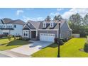 Beautiful single-story home showcasing manicured landscaping and an attached two-car garage at 537 Indigo Bay Circle, Myrtle Beach, SC 29579