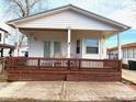 Charming home featuring a cozy front porch with brown wood trim at 6001-5117 S Kings Hwy., Myrtle Beach, SC 29575