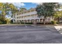 Comfortable condo building with pristine parking, manicured landscaping, and a welcoming feel at 679 Riverwalk Dr. # 202, Myrtle Beach, SC 29579