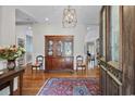 Elegant foyer with hardwood floors, decorative cabinet, and refined details throughout at 741 Tuckers Rd., Pawleys Island, SC 29585