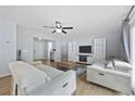Bright and spacious living room featuring two couches, modern fixtures, and ample natural light, ideal for relaxation and entertainment at 1097 Stoney Falls Blvd., Myrtle Beach, SC 29579
