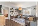 Bright living room with hardwood floors, shelving, and comfortable seating at 112 Rialto Dr., Conway, SC 29526