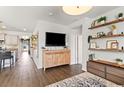 Stylish living room featuring an entertainment center and decorative shelving at 112 Rialto Dr., Conway, SC 29526