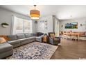 Open-concept living room with hardwood floors, a large window and a dining area at 112 Rialto Dr., Conway, SC 29526