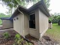 A close up exterior view showing the siding, window, and gutters at 116 Hickory Dr., Conway, SC 29526