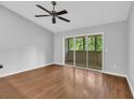 Spacious, bright bedroom with a sliding glass door, hardwood flooring, and neutral paint at 1260 White Tree Ln. # F, Myrtle Beach, SC 29588