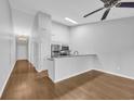 Bright open-concept kitchen featuring stainless steel appliances, light cabinets and an adjacent dining area at 1260 White Tree Ln. # F, Myrtle Beach, SC 29588