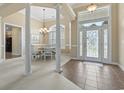 Bright foyer and dining room with decorative columns and high ceilings at 127 Willow Bay Dr., Murrells Inlet, SC 29576